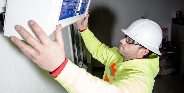 Man installing air conditioning system.