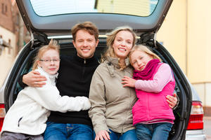 Family members getting ready for a road trip.