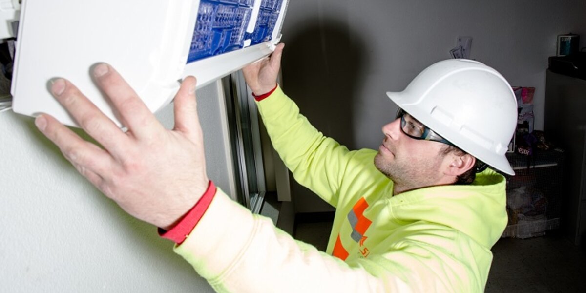 Man installing air conditioning system.