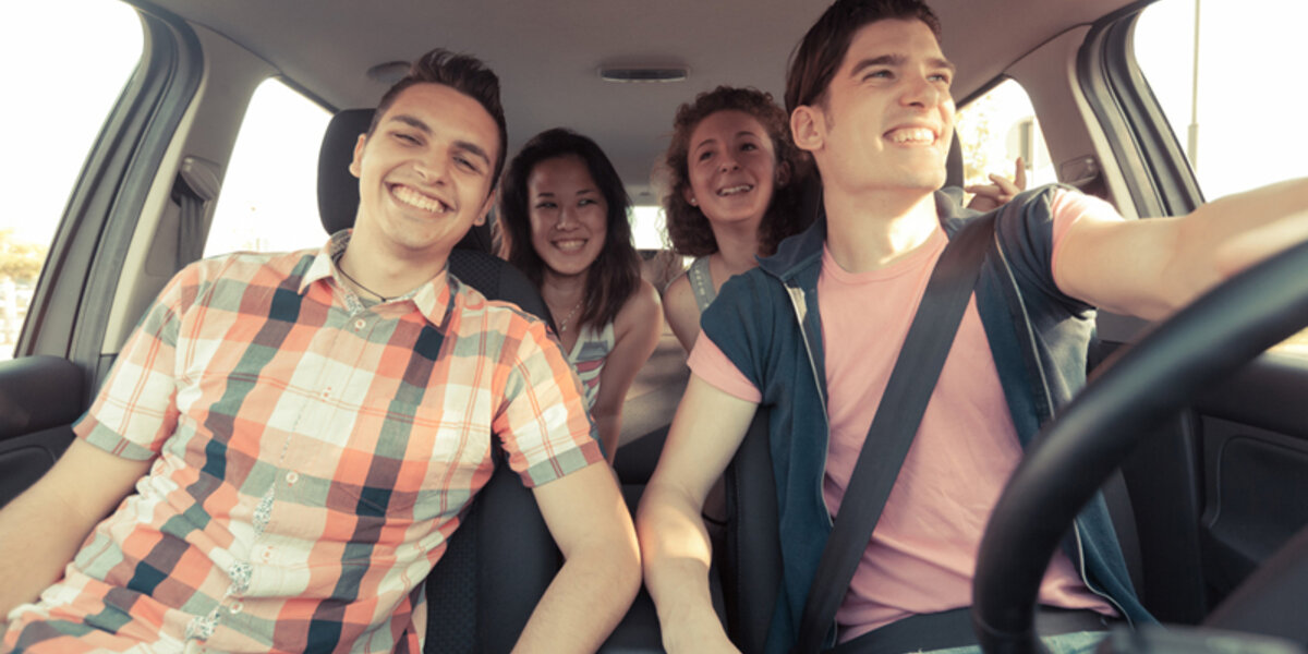 Four Friends Driving On a Summer Road Trip